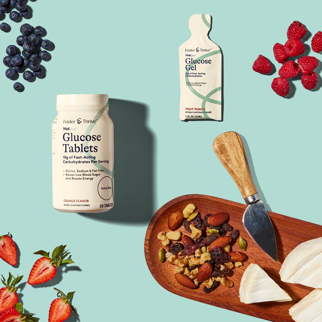 481096694_571793489230706_6080674939025336342_n Glucose tablets, gel, berries, nuts, brie, and a cheese knife arranged on a blue background.